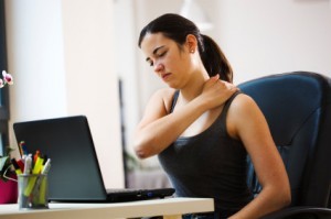 woman feeling neck and shoulder pain due to stress